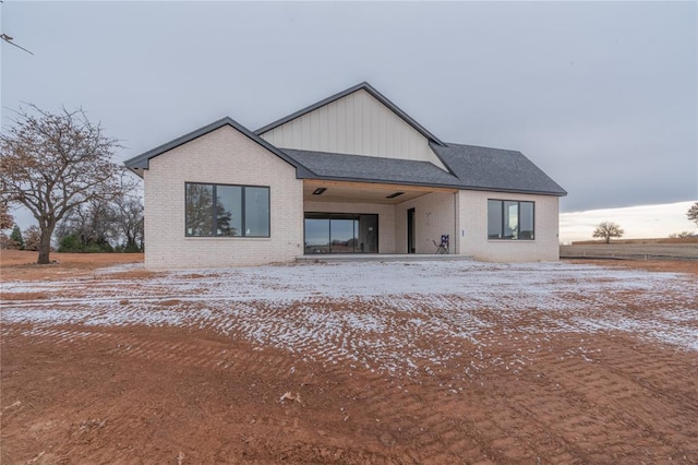 view of snow covered house