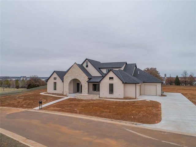 french country home with a garage