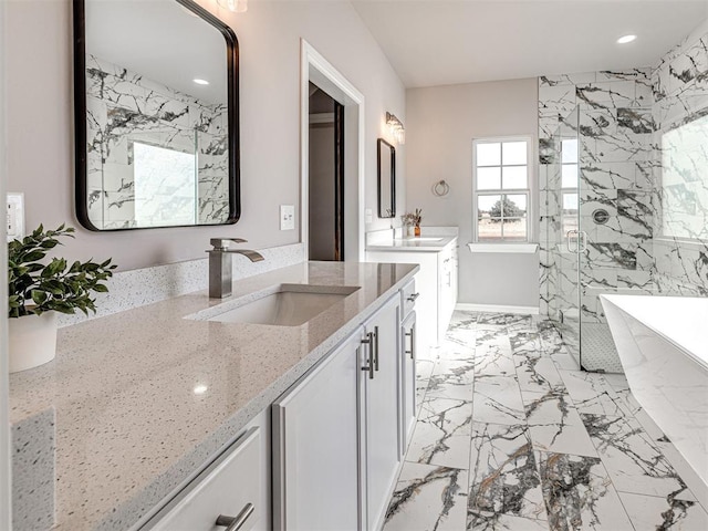 bathroom with vanity and separate shower and tub