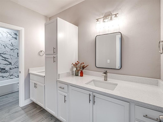 full bathroom featuring bathing tub / shower combination, vanity, and toilet