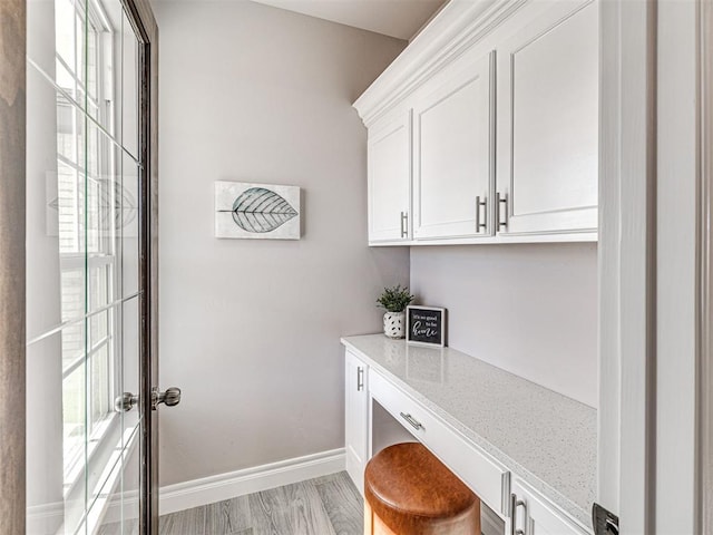 office area with a wealth of natural light and light hardwood / wood-style flooring