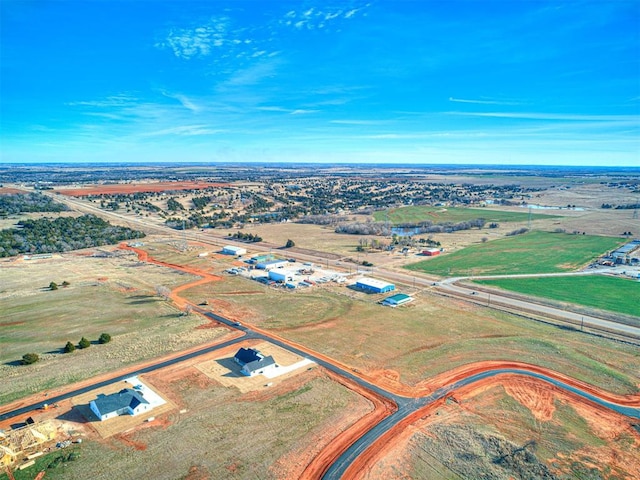 birds eye view of property with a rural view