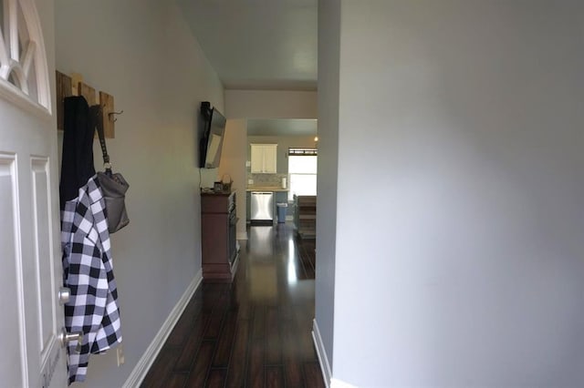 corridor featuring dark hardwood / wood-style floors