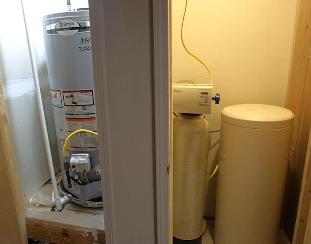 utility room featuring water heater