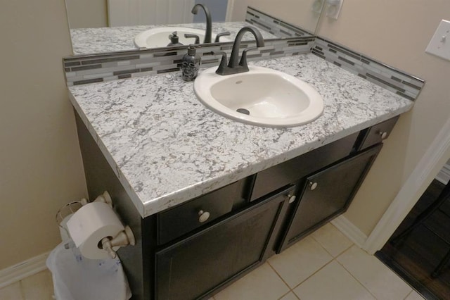 bathroom featuring tile patterned flooring and vanity