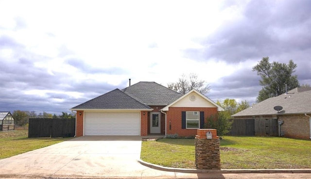 view of front facade with a front yard and a garage