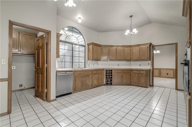 kitchen with dishwasher, sink, a notable chandelier, oven, and decorative light fixtures