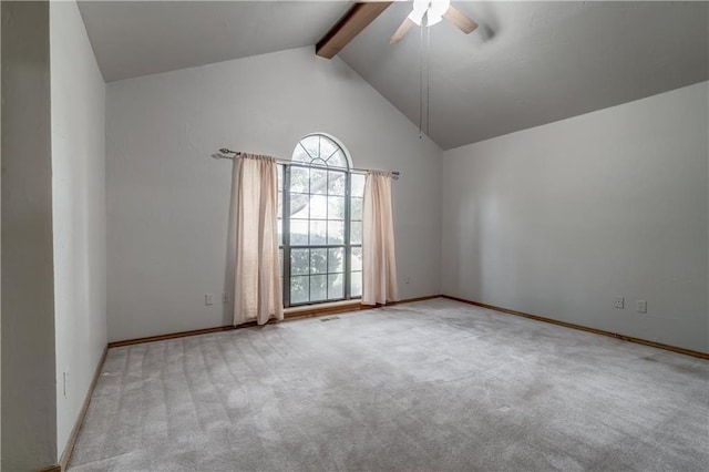 spare room featuring beamed ceiling, ceiling fan, light colored carpet, and high vaulted ceiling