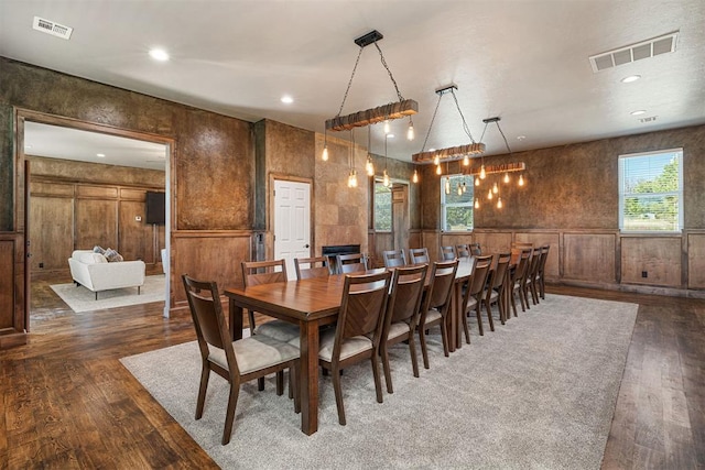 dining area with dark hardwood / wood-style flooring and a wealth of natural light