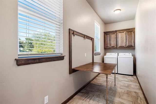 laundry room with cabinets and separate washer and dryer