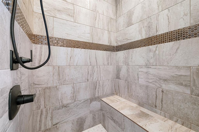 bathroom featuring a tile shower