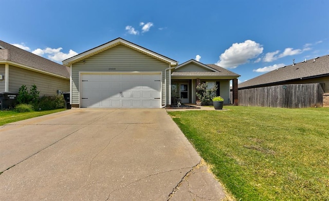 ranch-style house featuring a front lawn and a garage