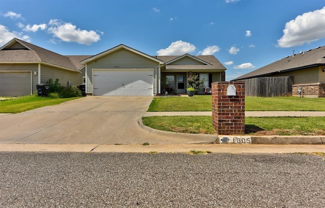 view of front of house with a front lawn and a garage