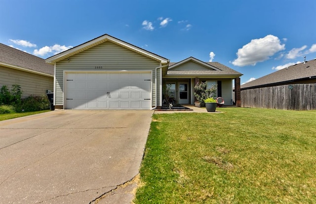 single story home featuring a garage and a front lawn