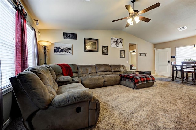 living room featuring carpet, plenty of natural light, ceiling fan, and lofted ceiling