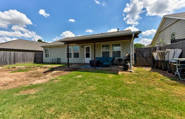 rear view of house featuring a lawn, a patio area, and an outdoor hangout area