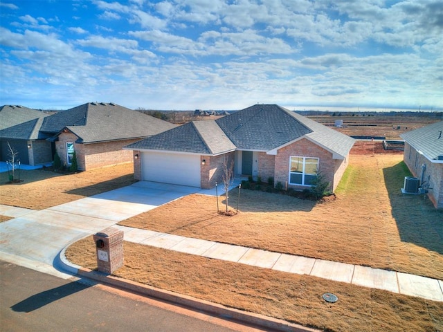 ranch-style house with central air condition unit, a front lawn, and a garage