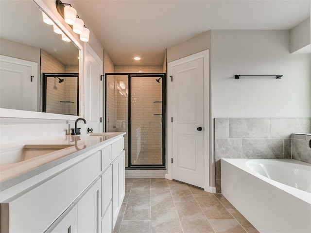 bathroom with vanity, tile patterned floors, and independent shower and bath