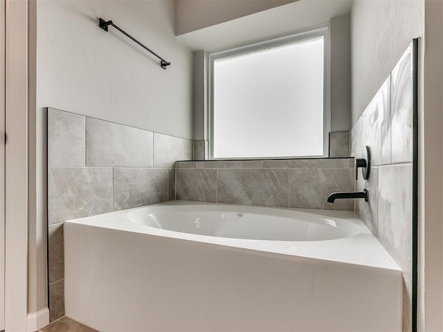 bathroom featuring a tub to relax in