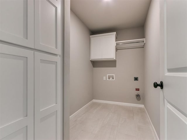 laundry room featuring cabinets, hookup for a washing machine, and electric dryer hookup