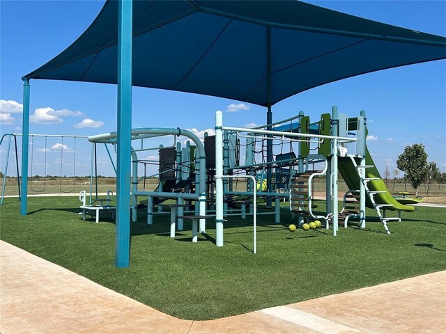 view of jungle gym featuring a yard