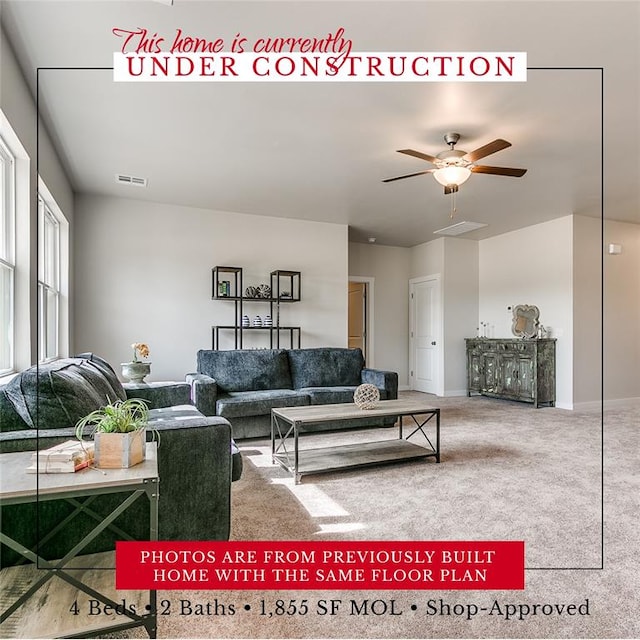 living room featuring carpet and ceiling fan