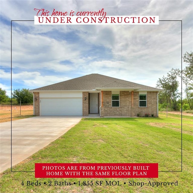 ranch-style house with a garage and a front lawn