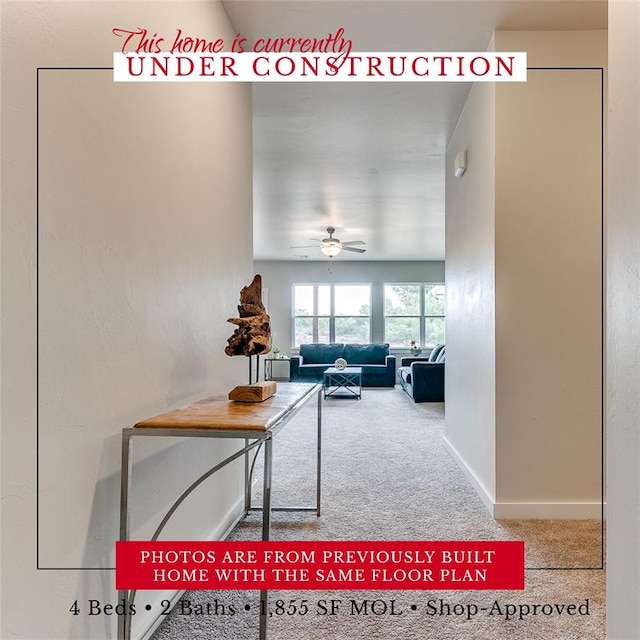 interior space featuring ceiling fan and carpet flooring