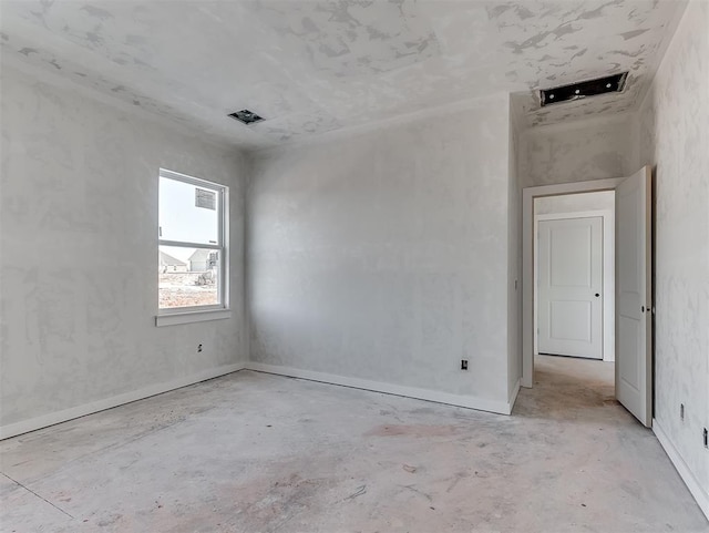 empty room featuring concrete floors and visible vents