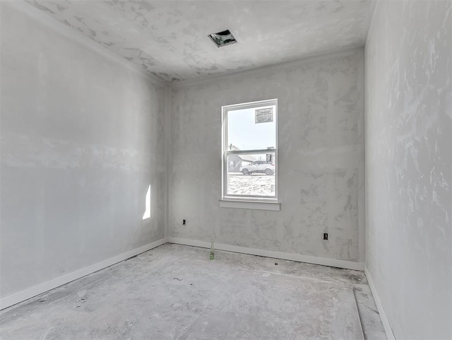 spare room featuring baseboards