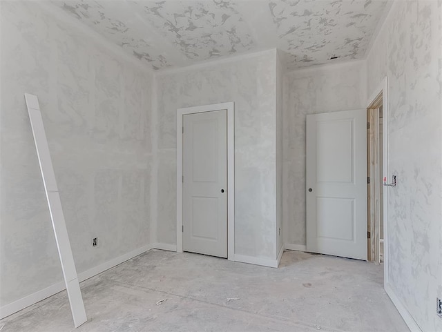 unfurnished bedroom featuring baseboards