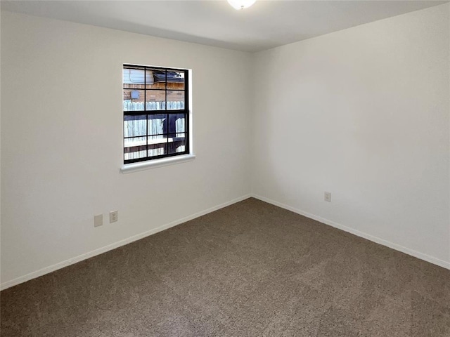 unfurnished room featuring carpet flooring