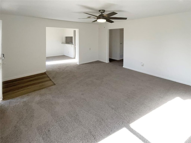 empty room with carpet and ceiling fan