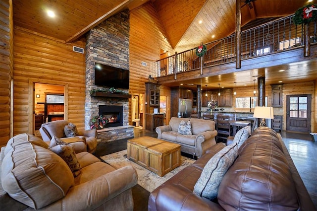 living room featuring a fireplace, wooden ceiling, rustic walls, and high vaulted ceiling