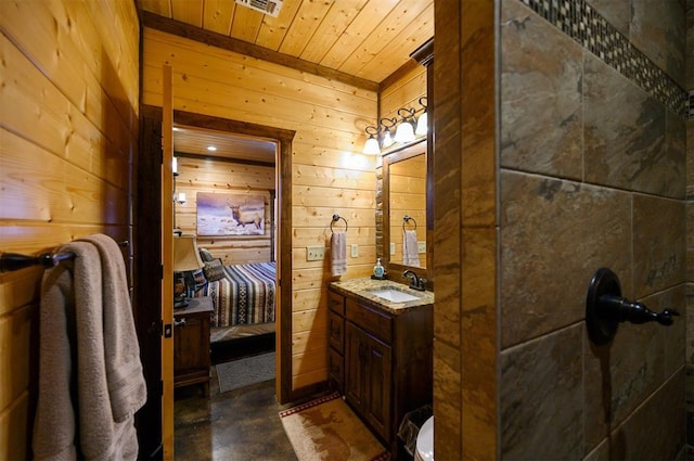 bathroom featuring wooden walls, vanity, and wooden ceiling