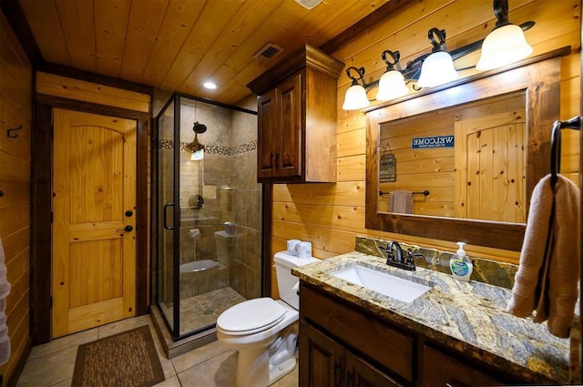 bathroom with vanity, tile patterned floors, walk in shower, and wooden walls