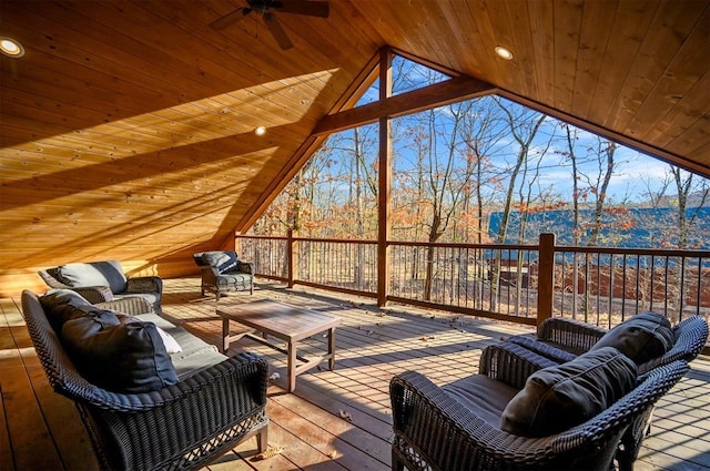 wooden deck with an outdoor living space and ceiling fan