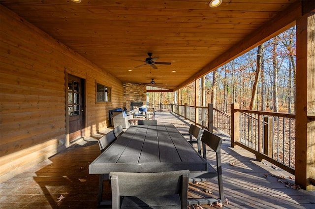 wooden deck featuring ceiling fan