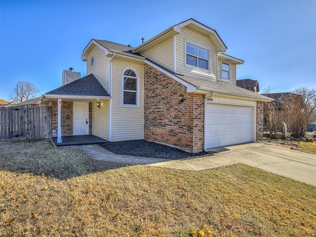 front facade featuring a front lawn and a garage