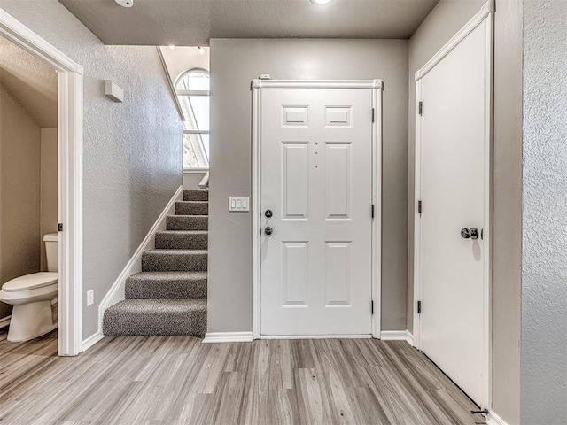 foyer with light hardwood / wood-style floors