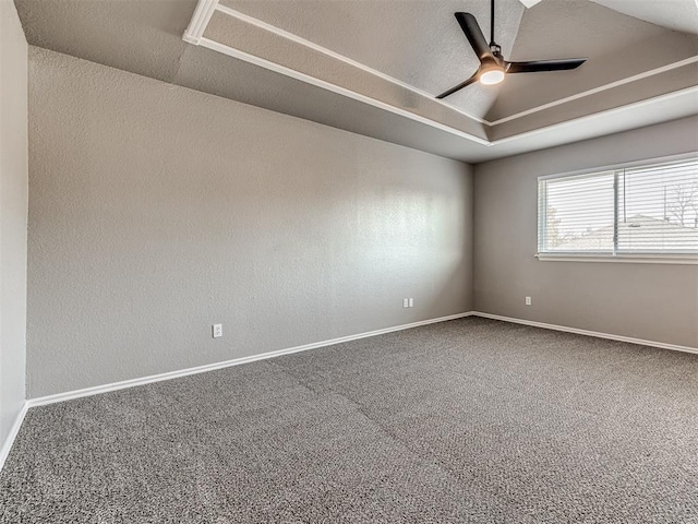 empty room featuring ceiling fan and carpet floors