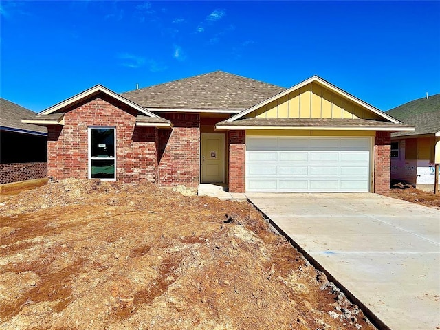 single story home with brick siding, roof with shingles, concrete driveway, an attached garage, and board and batten siding