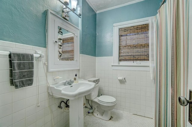 bathroom with walk in shower, crown molding, tile walls, tile patterned flooring, and toilet