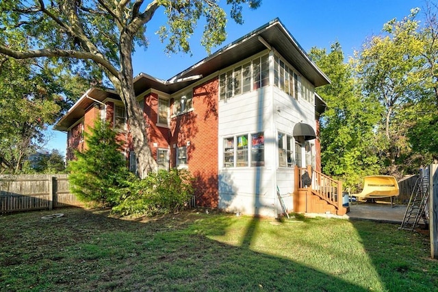 view of property exterior with a lawn