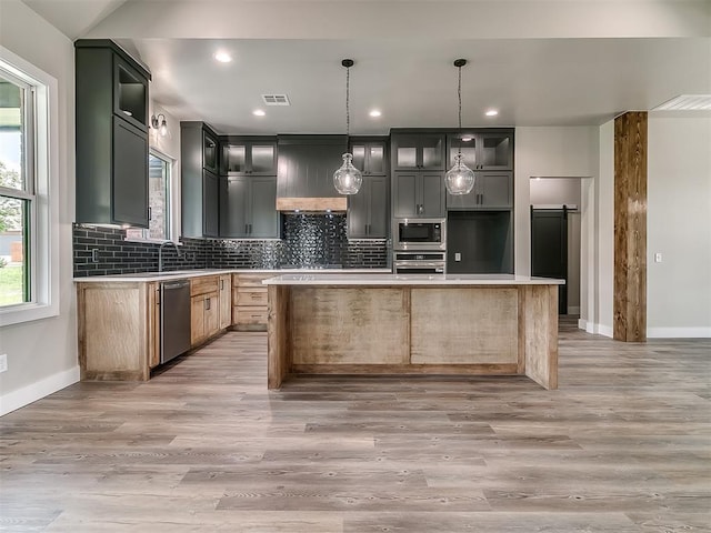 2233 W Sunset Dr, Mustang, OK 73064 - kitchen featuring stainless steel appliances, baseboards, backsplash, light countertops, and recessed lighting