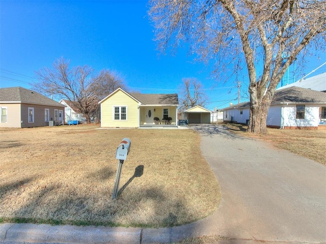 single story home with an outbuilding