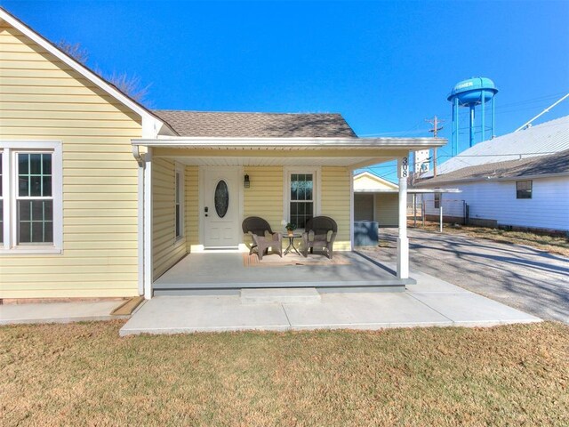 doorway to property featuring a yard and a patio area