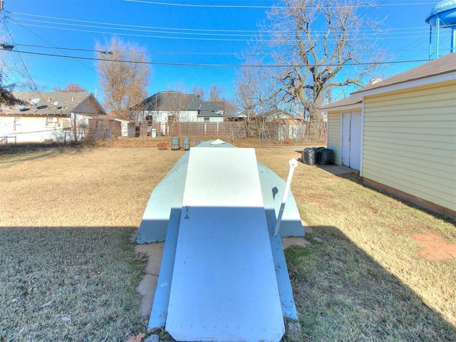 view of storm shelter with a lawn