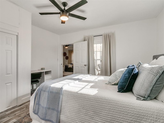 bedroom with hardwood / wood-style flooring and ceiling fan