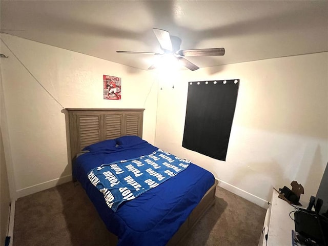 bedroom with ceiling fan and dark carpet